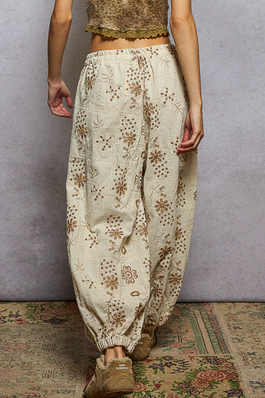 floral embroidered jogger pants, quilted jogger pants women, boho embroidered pants, boutique joggers women, natural floral print joggers, relaxed fit embroidered pants, trendy quilted jogger trousers, women’s boho lounge pants, boutique streetwear joggers, artisan embroidered pants
