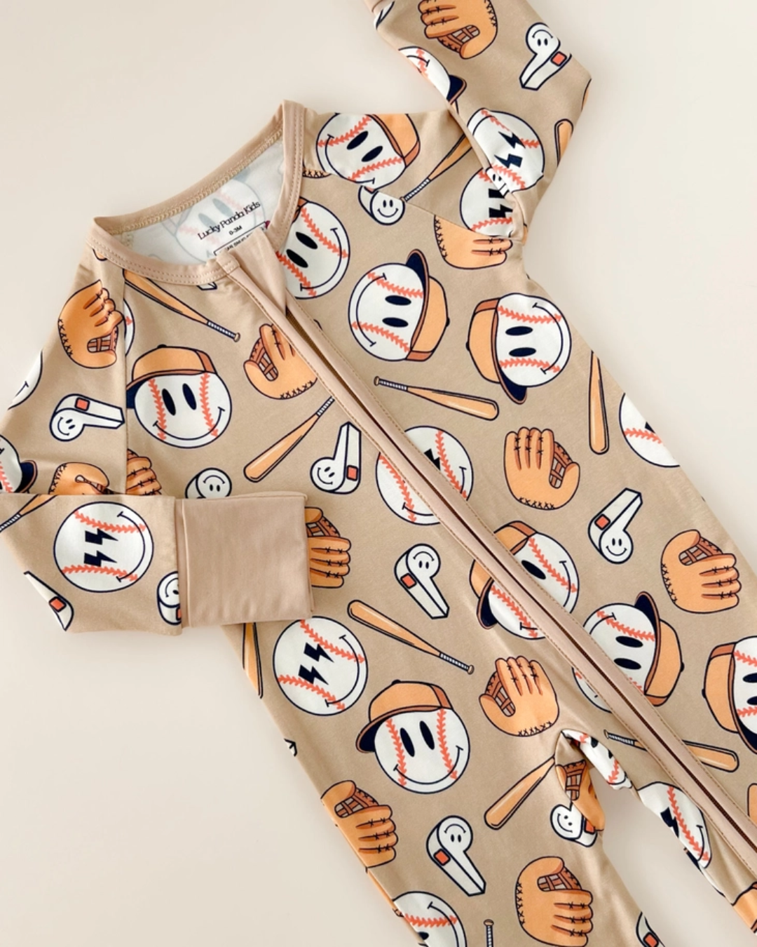 baseball baby romper, bamboo infant romper, sports themed baby clothes, neutral baby romper, cozy infant outfit, boutique baby romper, long sleeve baby romper, playful baby boy outfit, unisex baby romper, easy zip baby romper, sporty infant clothing, toddler game day outfit
