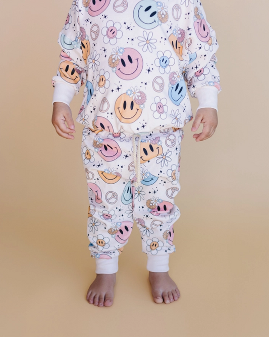 2pc jogger set kids, smiley face jogger outfit, peace sign kids clothing, daisy print kids set, retro kids jogger outfit, pastel toddler loungewear, boutique kids jogger set, groovy girl jogger set, girls matching jogger outfit, trendy toddler lounge set, back to school clothes, school outfits, pre-k clothing