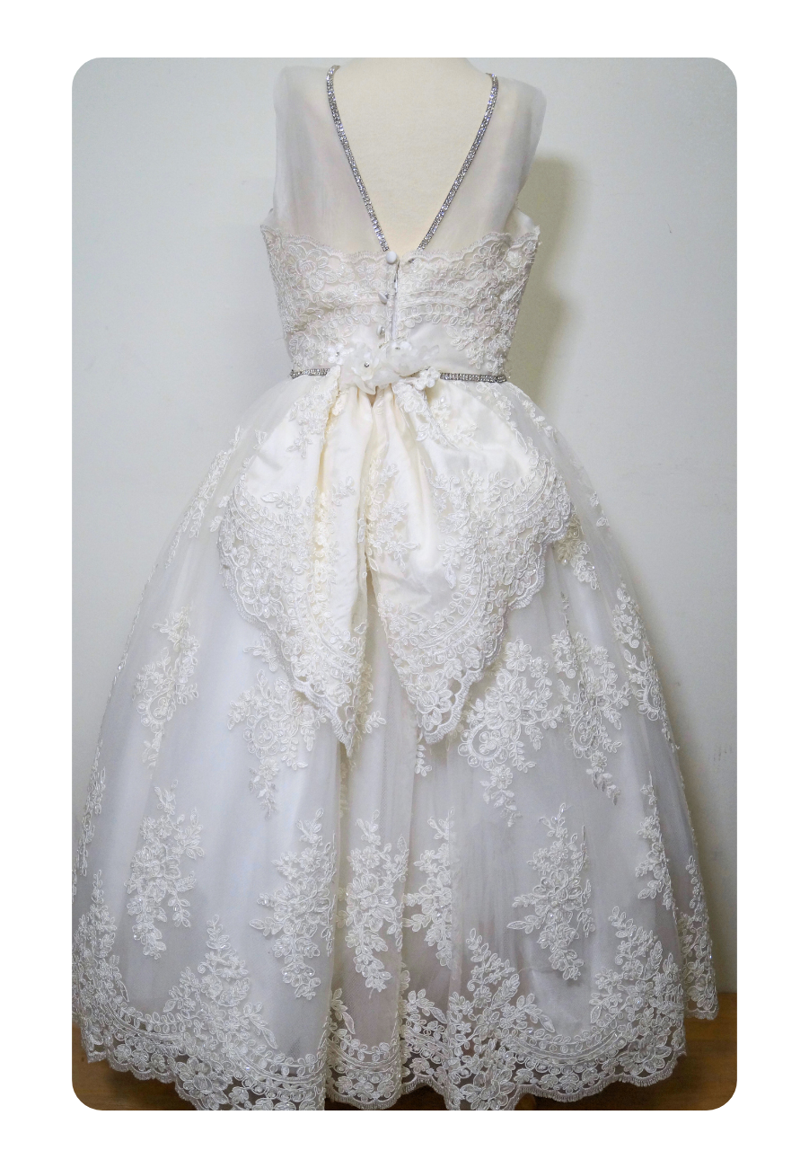 beaded lace communion dress Expressions Boutique NY, one of a kind communion gown, mesh overlay first communion dress, girls white lace communion attire Woodbury NY, boutique communion wear Long Island, elegant lace beaded gown