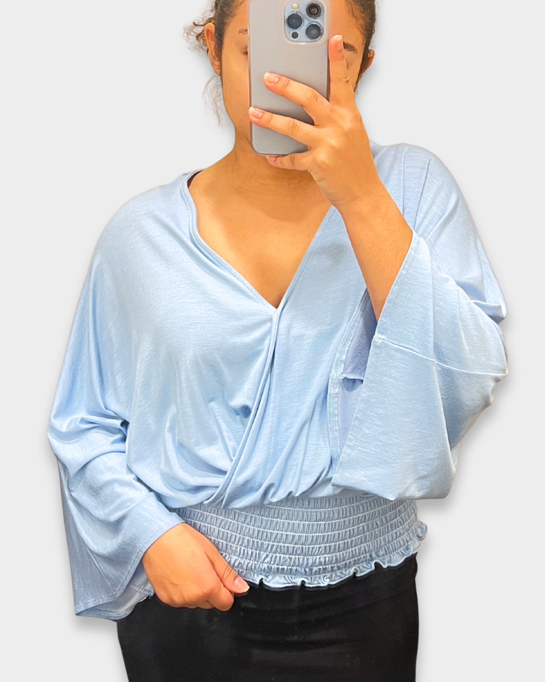 women’s smocked top, light blue blouse, v-neck draped top, boutique women’s fashion, silky smocked shirt, trendy women’s tops, dressy casual blouse, lightweight long sleeve top