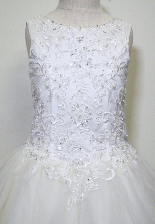 one of a kind communion dress Expressions Boutique NY, lace ruffled tulle communion gown, white first communion dress, boutique communion wear Long Island, elegant layered tulle gown for girls, handmade communion dress Woodbury NY