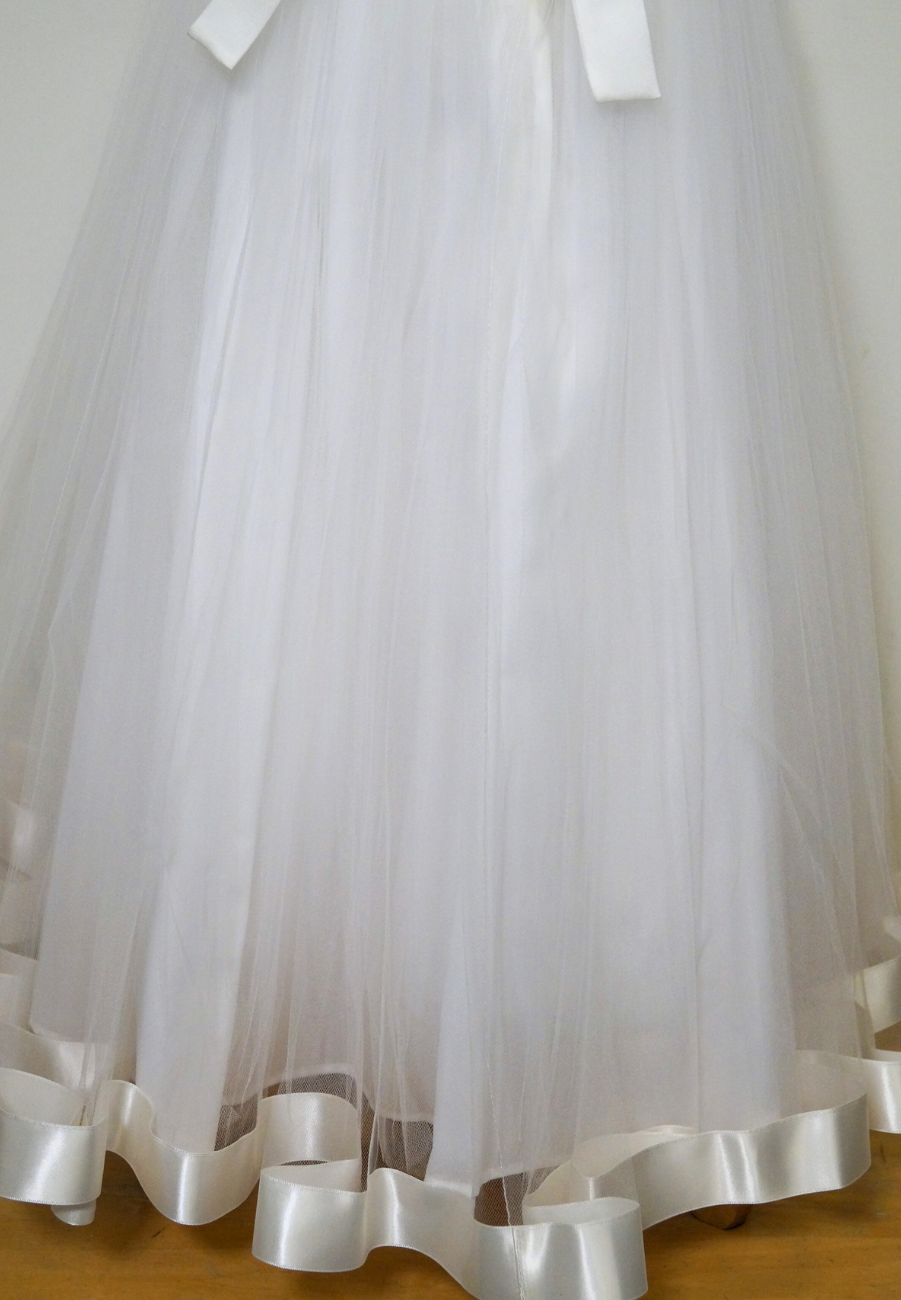 satin and tulle communion dress Expressions Boutique NY, pearl bow communion gown, diamond white communion dress, girls white satin bodice tulle skirt, boutique communion wear Long Island, elegant first communion dress Woodbury NY