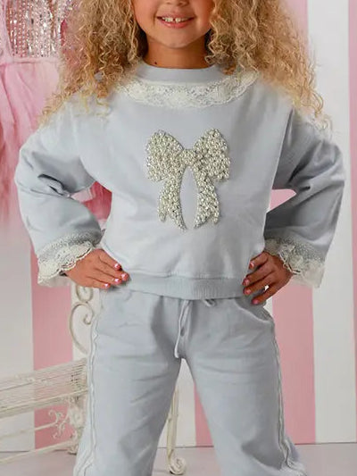 ice pop blue sweatpant set, boutique girls loungewear, 2-piece girls outfit, sequin bow top set, lace trim sweatshirt set, boutique kids clothing, stylish toddler outfit, comfy girls sweat set, girls matching sweatpant set, elevated casual kidswear, trendy girls fall outfit, toddler boutique loungewear
