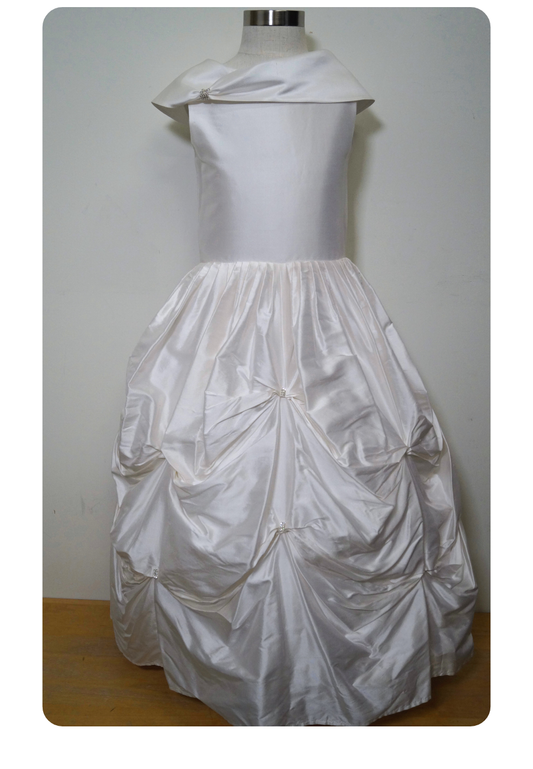 one of a kind satin communion dress Expressions Boutique NY, ruched satin communion gown, white pearl detail first communion dress, boutique communion wear Long Island, elegant satin ball gown for girls, special occasion dress Woodbury NY