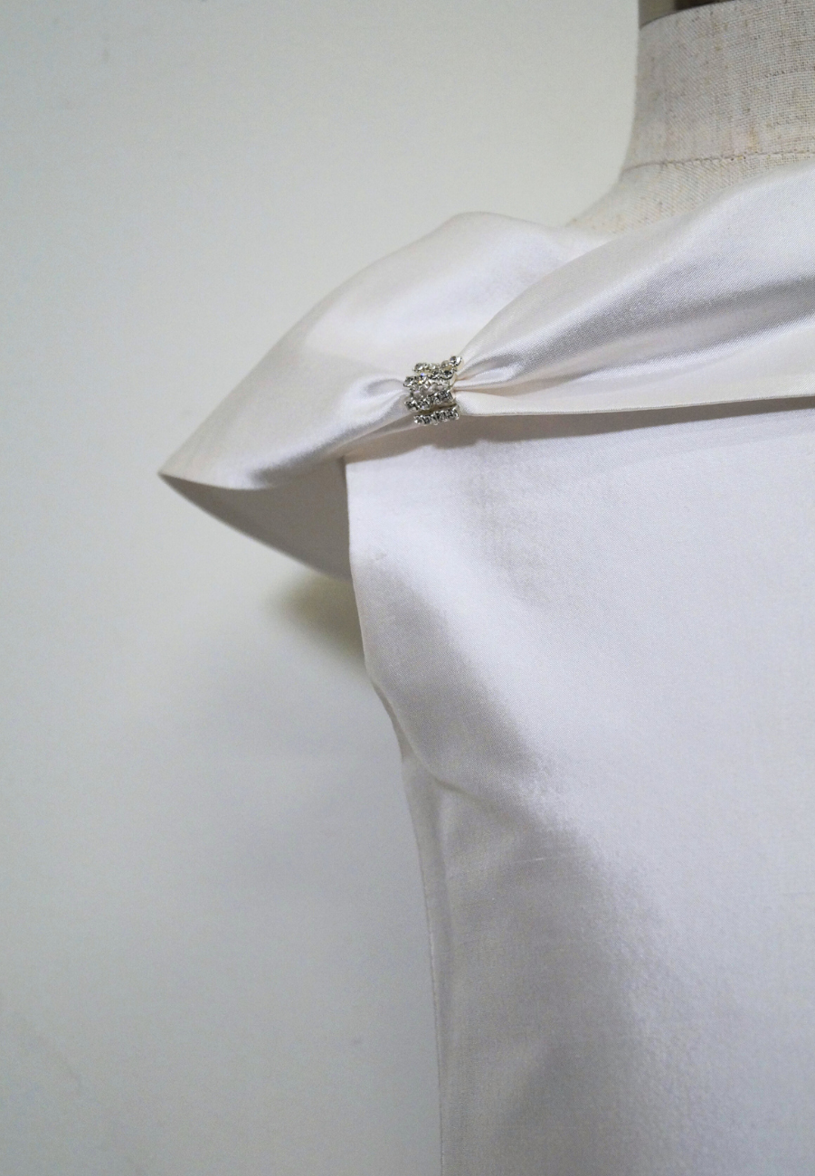 one of a kind satin communion dress Expressions Boutique NY, ruched satin communion gown, white pearl detail first communion dress, boutique communion wear Long Island, elegant satin ball gown for girls, special occasion dress Woodbury NY