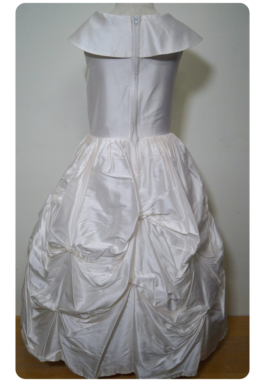 one of a kind satin communion dress Expressions Boutique NY, ruched satin communion gown, white pearl detail first communion dress, boutique communion wear Long Island, elegant satin ball gown for girls, special occasion dress Woodbury NY