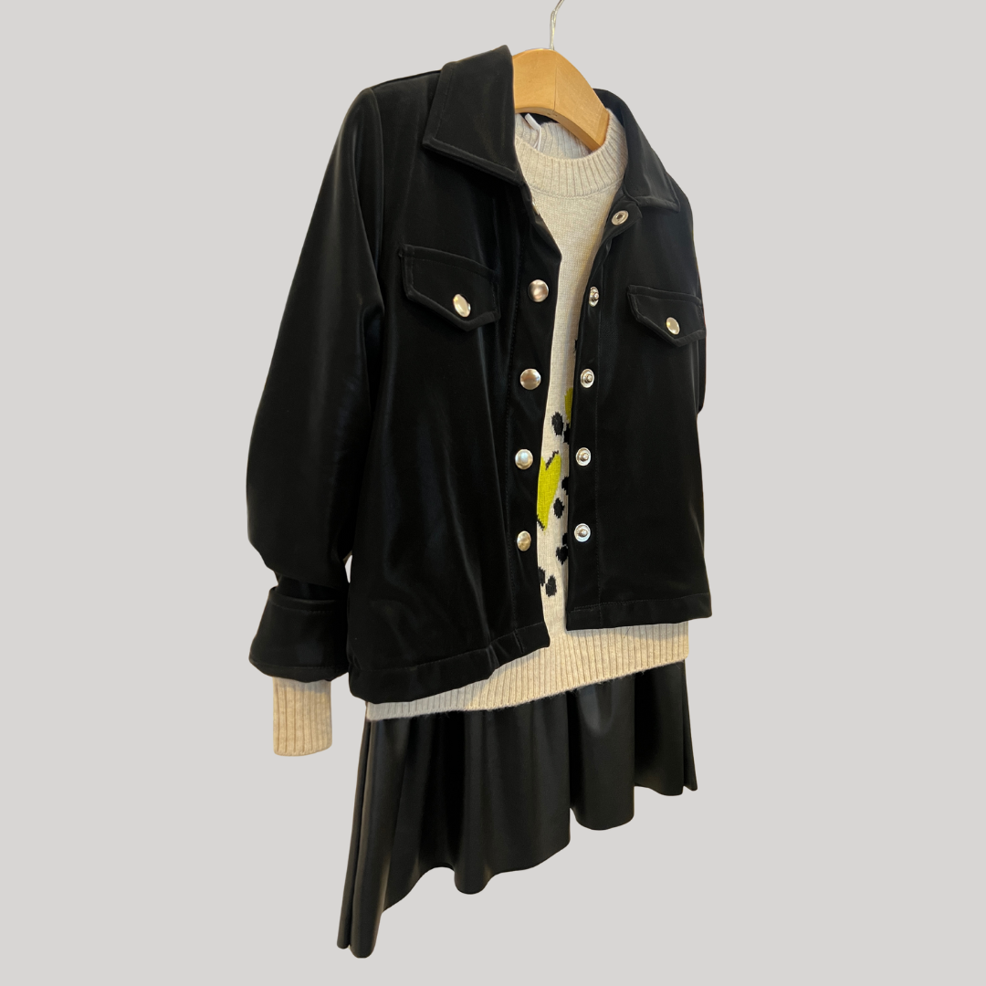 black faux suede jacket, women’s faux suede outerwear, silver button jacket, utility pocket jacket, fall layering jacket, boutique black jacket, soft suede look jacket, cropped suede effect jacket, versatile women’s jacket, modern casual jacket