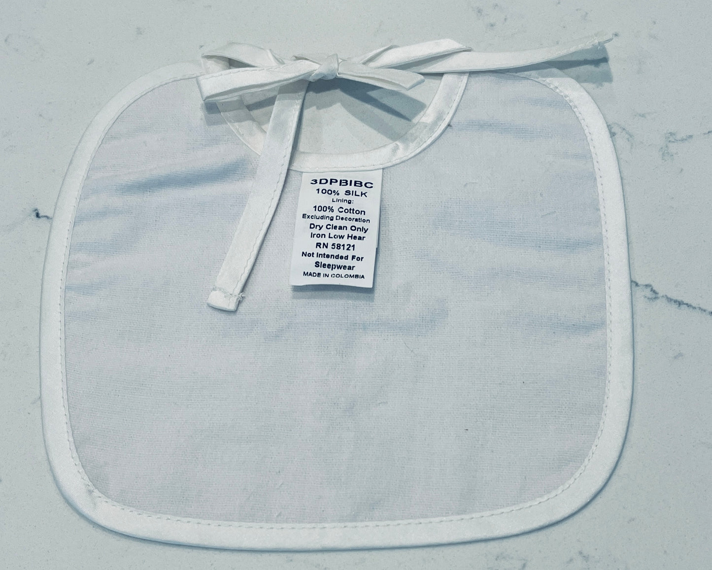 Little Things Mean a Lot White Dupioni Silk Baby Bib