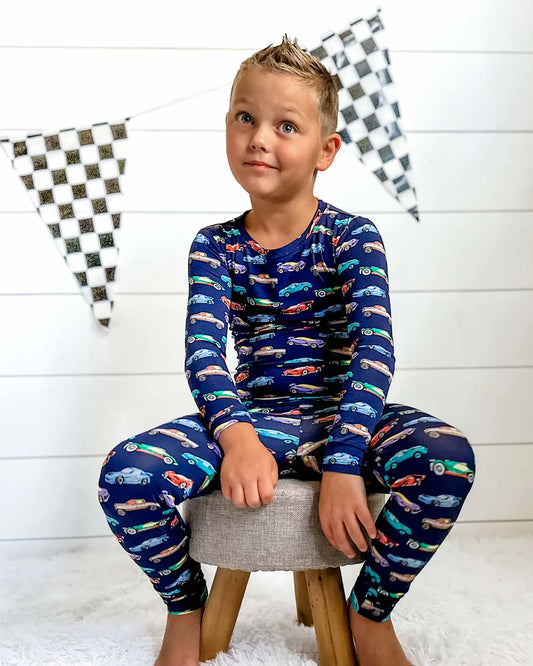 toddler boys car pajamas, kids trucks lounge set, boutique boys pajama set, navy car print pjs, 2 piece kids car sleepwear, Expressions Boutique NY, Woodbury boutique kids clothes, children’s pajamas with cars, boys holiday sleep set, toddler boys lounge outfit, comfy boys pajama set, car print long sleeve pajamas