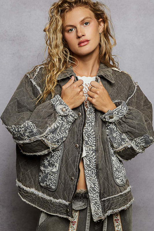 black lace overlay quilted jacket, embroidered quilted jacket, lace patch denim jacket, oversized quilted jacket women, boho chic outerwear, boutique quilted jacket, lace detail casual jacket, statement layering jacket, embroidered denim quilt jacket, boutique women’s fashion NY, fall layering jacket, romantic edgy quilted coat