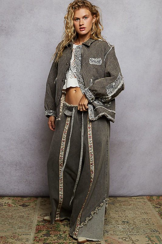 black lace overlay quilted jacket, embroidered quilted jacket, lace patch denim jacket, oversized quilted jacket women, boho chic outerwear, boutique quilted jacket, lace detail casual jacket, statement layering jacket, embroidered denim quilt jacket, boutique women’s fashion NY, fall layering jacket, romantic edgy quilted coat