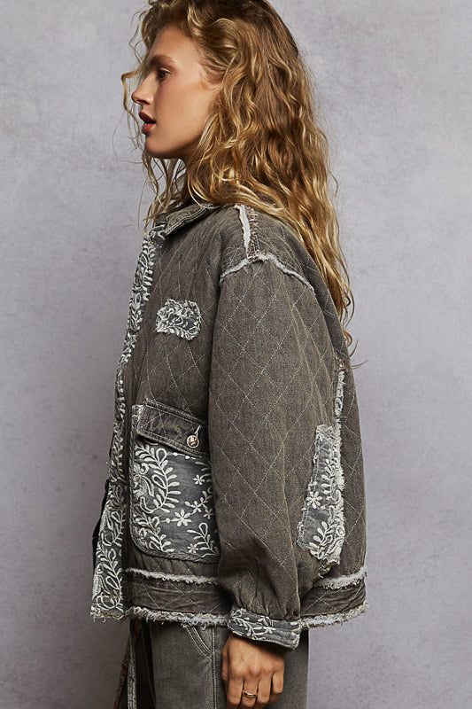 black lace overlay quilted jacket, embroidered quilted jacket, lace patch denim jacket, oversized quilted jacket women, boho chic outerwear, boutique quilted jacket, lace detail casual jacket, statement layering jacket, embroidered denim quilt jacket, boutique women’s fashion NY, fall layering jacket, romantic edgy quilted coat