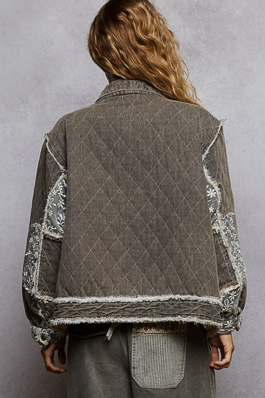 black lace overlay quilted jacket, embroidered quilted jacket, lace patch denim jacket, oversized quilted jacket women, boho chic outerwear, boutique quilted jacket, lace detail casual jacket, statement layering jacket, embroidered denim quilt jacket, boutique women’s fashion NY, fall layering jacket, romantic edgy quilted coat