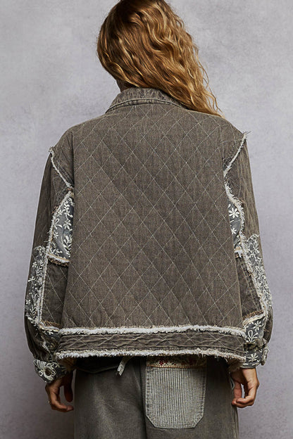 black lace overlay quilted jacket, embroidered quilted jacket, lace patch denim jacket, oversized quilted jacket women, boho chic outerwear, boutique quilted jacket, lace detail casual jacket, statement layering jacket, embroidered denim quilt jacket, boutique women’s fashion NY, fall layering jacket, romantic edgy quilted coat