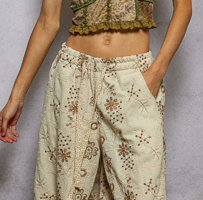 floral embroidered jogger pants, quilted jogger pants women, boho embroidered pants, boutique joggers women, natural floral print joggers, relaxed fit embroidered pants, trendy quilted jogger trousers, women’s boho lounge pants, boutique streetwear joggers, artisan embroidered pants