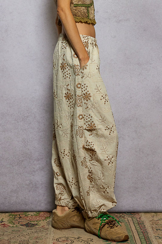 floral embroidered jogger pants, quilted jogger pants women, boho embroidered pants, boutique joggers women, natural floral print joggers, relaxed fit embroidered pants, trendy quilted jogger trousers, women’s boho lounge pants, boutique streetwear joggers, artisan embroidered pants