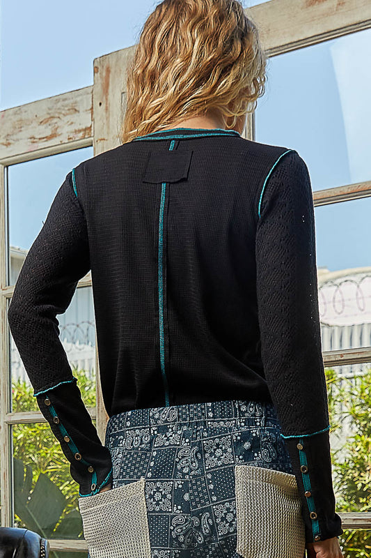 black knit top, women’s henley top, boutique long sleeve top, contrast stitch top, textured sleeve knit, casual black top for women, fall layering essentials, teal trim top, women’s boutique clothing
