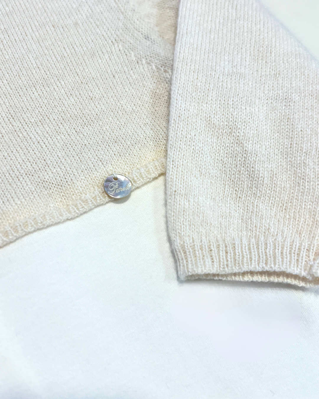 boutique baby cashmere footie Expressions Boutique NY, beige ivory cashmere cotton baby outfit, luxury unisex newborn footed onesie, soft knit baby gift set breathable cotton blend, heirloom baby footie premium knit