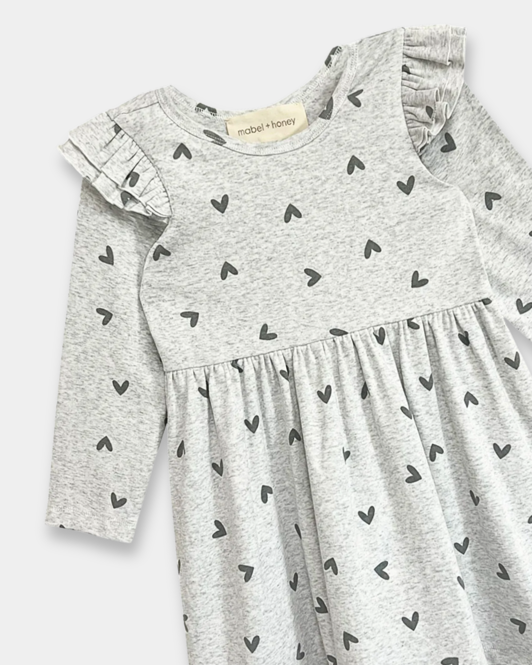 heart print toddler dress, girls grey dress with hearts, boutique toddler clothing, long sleeve ruffle dress, playful toddler girl outfit, kids boutique fashion, cozy toddler dress, everyday toddler outfits, boutique fall dresses for kids, stylish girls clothing, pre-k outfits, school picture day dress
