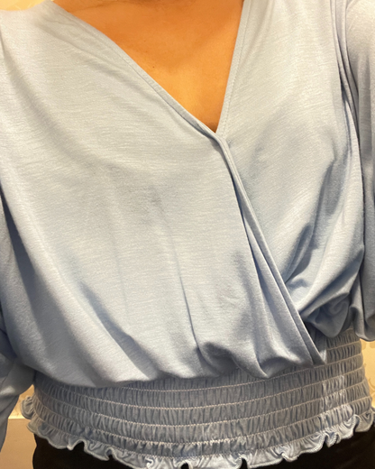 women’s smocked top, light blue blouse, v-neck draped top, boutique women’s fashion, silky smocked shirt, trendy women’s tops, dressy casual blouse, lightweight long sleeve top