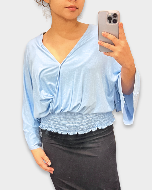 women’s smocked top, light blue blouse, v-neck draped top, boutique women’s fashion, silky smocked shirt, trendy women’s tops, dressy casual blouse, lightweight long sleeve top