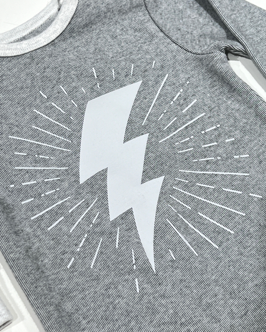 Grey Lightning Bolt Footie, Expressions Boutique, Women and childrens boutique, Woodbury, grey baby footie, baby boy lightning sleeper, boutique baby romper, infant footed one piece, soft cotton baby pajamas, newborn boy sleepsuit, snap closure baby outfit, modern baby boy footie, baby shower boy gift, lightning print baby romper