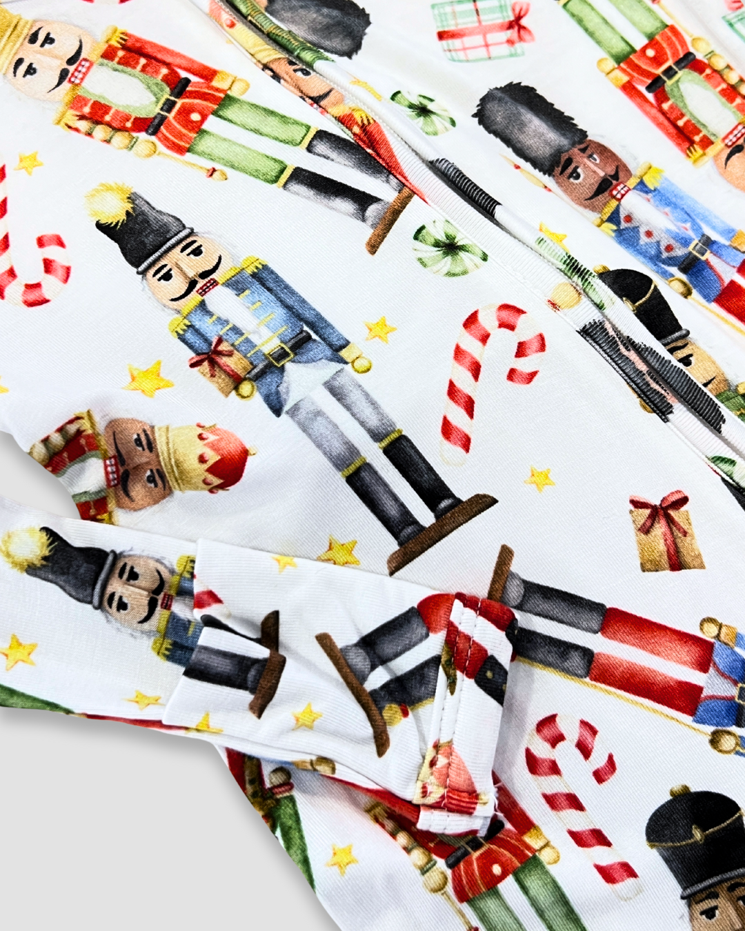 Nutcracker baby footie Expressions Boutique NY, holiday baby pajamas, Christmas soldier onesie, festive baby sleepwear, boutique holiday outfit, double zip baby footie