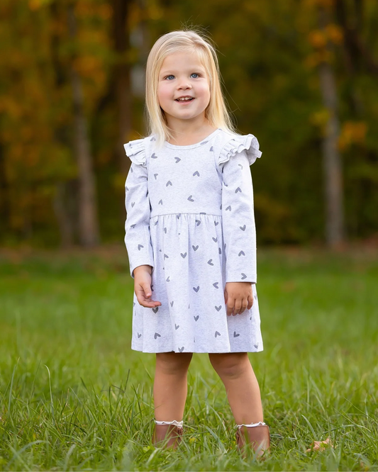 heart print toddler dress, girls grey dress with hearts, boutique toddler clothing, long sleeve ruffle dress, playful toddler girl outfit, kids boutique fashion, cozy toddler dress, everyday toddler outfits, boutique fall dresses for kids, stylish girls clothing, pre-k outfits, school picture day dress