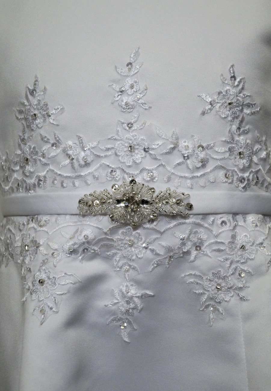 matted satin communion dress Expressions Boutique NY, girls white communion gown, sleeveless satin A-line dress, first communion attire Long Island, boutique communion wear Woodbury NY, elegant satin communion dress