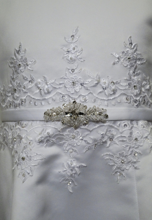 matted satin communion dress Expressions Boutique NY, girls white communion gown, sleeveless satin A-line dress, first communion attire Long Island, boutique communion wear Woodbury NY, elegant satin communion dress