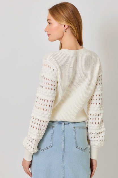 Mystree ivory textured sweater, bobble sleeve knit sweater, boutique ivory knitwear, women’s statement sleeve sweater, cozy chic ivory pullover, open-knit detail sweater, boutique fall sweater, ivory knit with textured sleeves, casual chic knitwear, women’s ivory sweater top