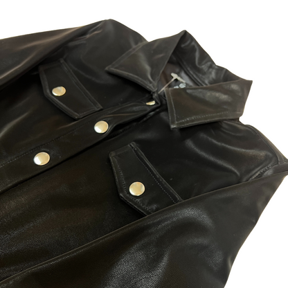 black faux suede jacket, women’s faux suede outerwear, silver button jacket, utility pocket jacket, fall layering jacket, boutique black jacket, soft suede look jacket, cropped suede effect jacket, versatile women’s jacket, modern casual jacket