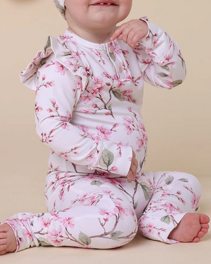 Cherry Blossom Organic Growsuit, Expressions Boutique, Women and childrens boutique, Woodbury, cherry blossom baby romper, floral organic growsuit, baby girl flower outfit, boutique infant romper, eco friendly baby clothes, newborn cherry blossom footie, baby shower gift girl, soft cotton floral sleeper, baby girl ruffle romper, spring print baby outfit