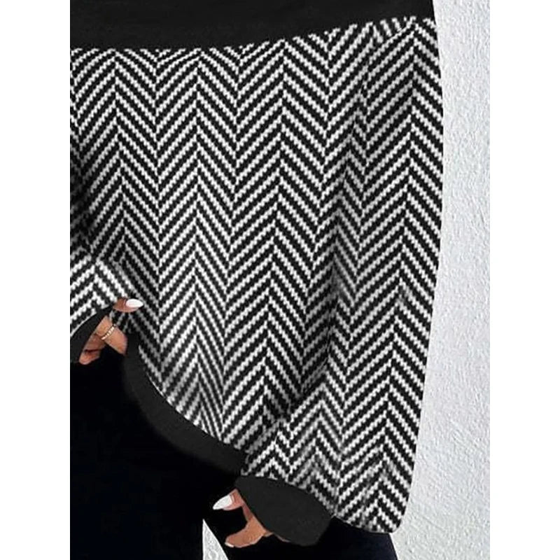 black high neck sweater, chevron stripe sweater, oversized knit sweater women, boutique black stripe sweater, split hem pullover sweater, chic winter sweater top, casual elegant knitwear, trendy high neck knit, black and white statement sweater, cozy fall winter sweater