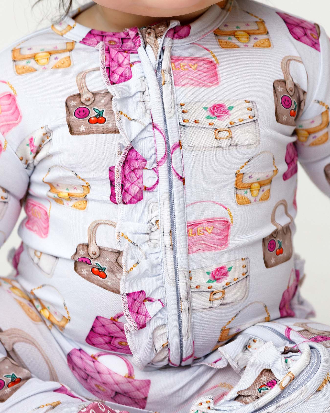 boutique baby bamboo footie Expressions Boutique NY, castle print ruffled zip baby sleeper, lavender floral baby onesie, soft bamboo footed pajamas, baby girl zippered sleeper breathable fabric