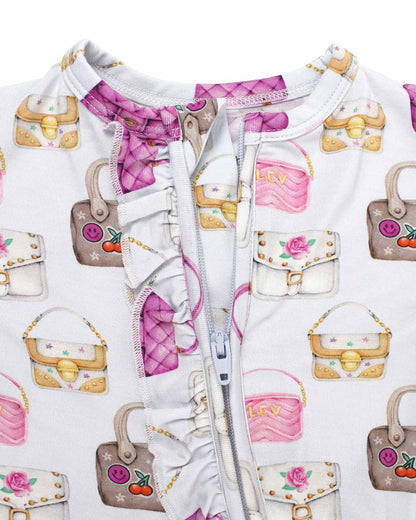Baby outfit with handbag pattern on a white background