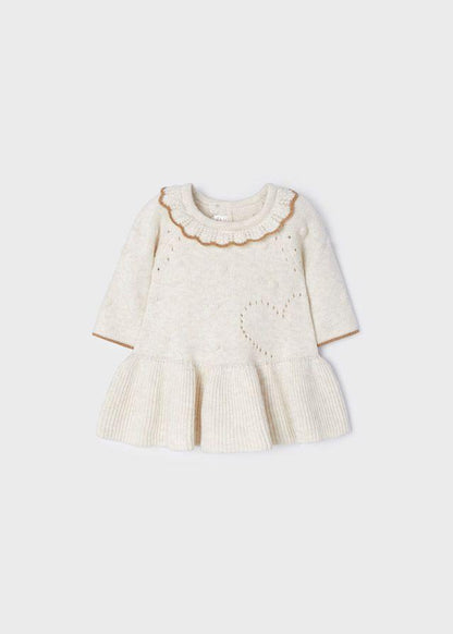boutique baby girl sweater dress, cream knit baby dress Expressions Boutique NY, tan trim toddler girl dress, heirloom knit baby dress cream, holiday baby girl sweater dress, boutique toddler fashion neutral tones, cozy fall winter baby dress, special occasion knitwear for girls, soft cotton knit baby dress